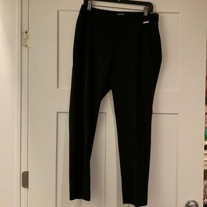 Black ladies ankle length side zip slacks. Size 10 by Ellen Tracy.